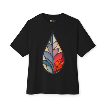 Black Stained Glass Botanical Raindrop Oversized Tee Shirt by Bella+Canvas, unisex with a teardrop-shaped, colorful stained glass pattern showcasing abstract botanical designs in blue, pink, and red shades designed by Noelle Barnes.