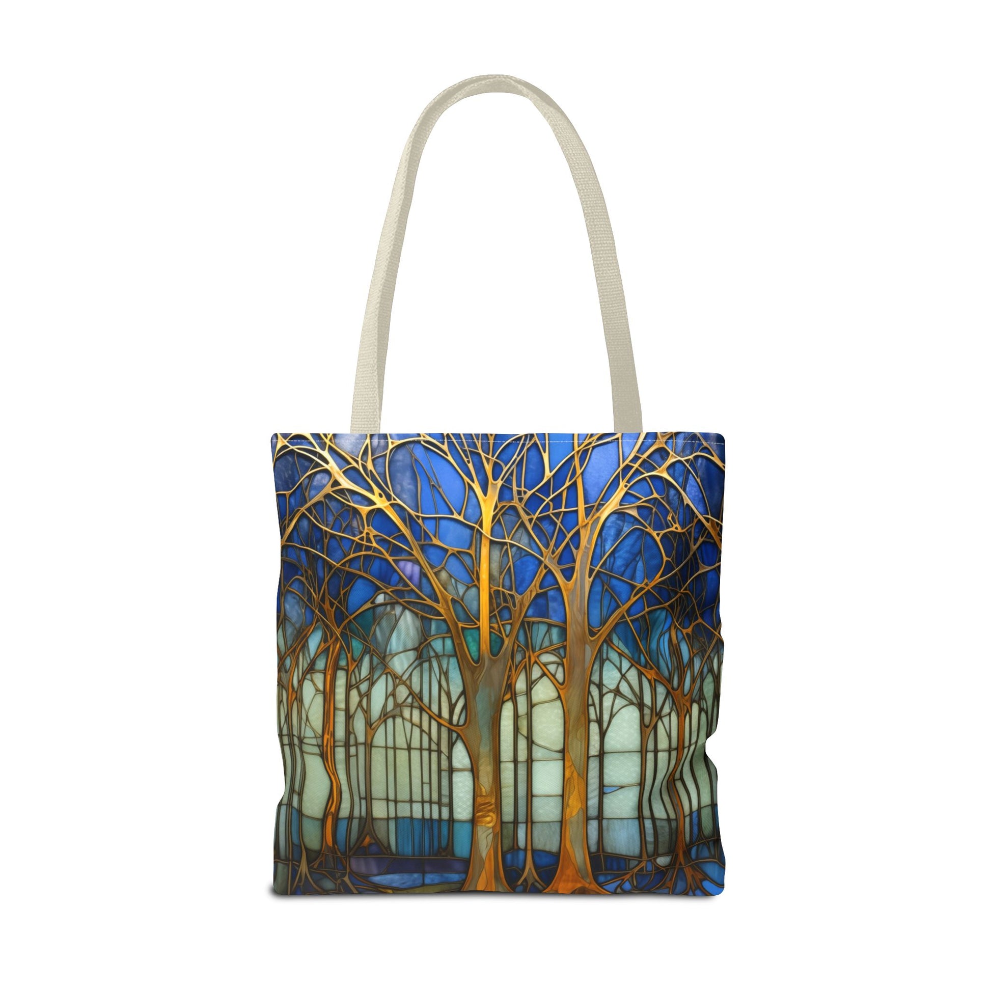 The Stained Glass Forest Tote Bag, available in blue and three sizes, showcases an original design of trees with bare golden branches against a vibrant blue and green background. Made from durable polyester, it offers both style and sturdiness.