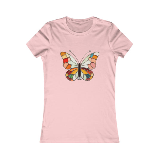 Introducing the Stained Glass Groovy Butterfly Women's Tee Shirt: a light pink t-shirt adorned with a vibrant butterfly design on the front, showcasing shades of orange, red, yellow, and blue. This comfortable tee features a colorful pattern that captures the essence of stained glass art.