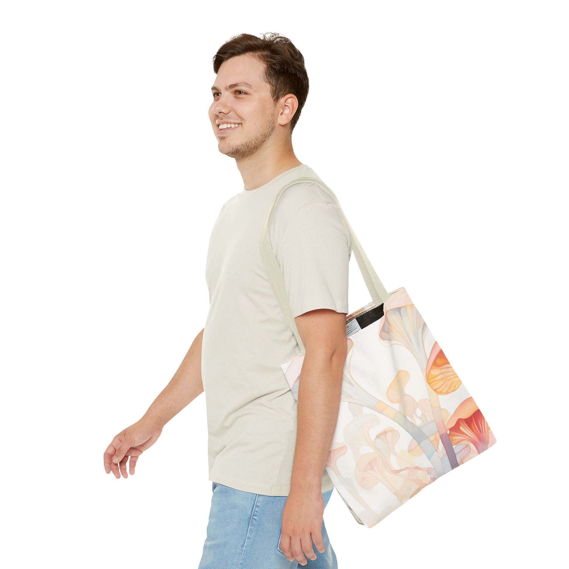 A person in a light shirt and jeans smiles while walking, carrying the Groovy Rainbow Mushrooms Stained Glass Tote Bag, featuring a colorful abstract design. The background is plain white.