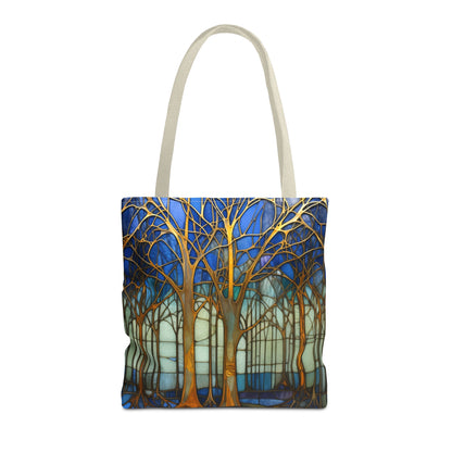 The Stained Glass Forest Tote Bag in blue, available in three sizes, features original golden tree designs on a blue and teal backdrop. Made from durable polyester, the intricate branches gracefully stretch across the bag.