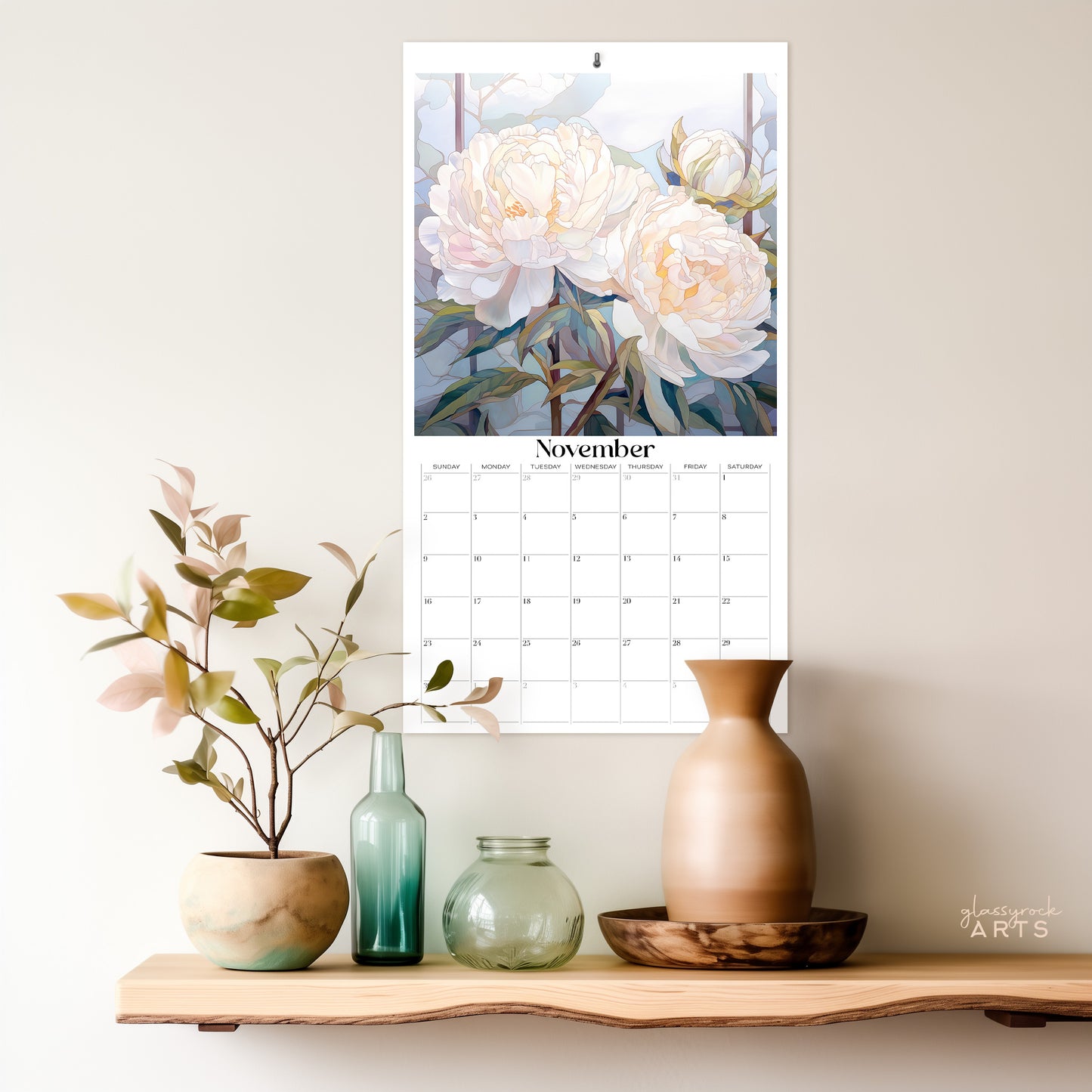 The birth flowers calendar hanging on a wall above a shelf.