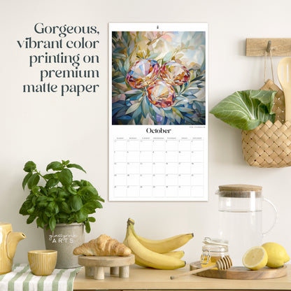 The birthstones calendar hanging in a kitchen with kitchen tools below on a counter. It has gorgeous, vibrant color printing on premium paper.