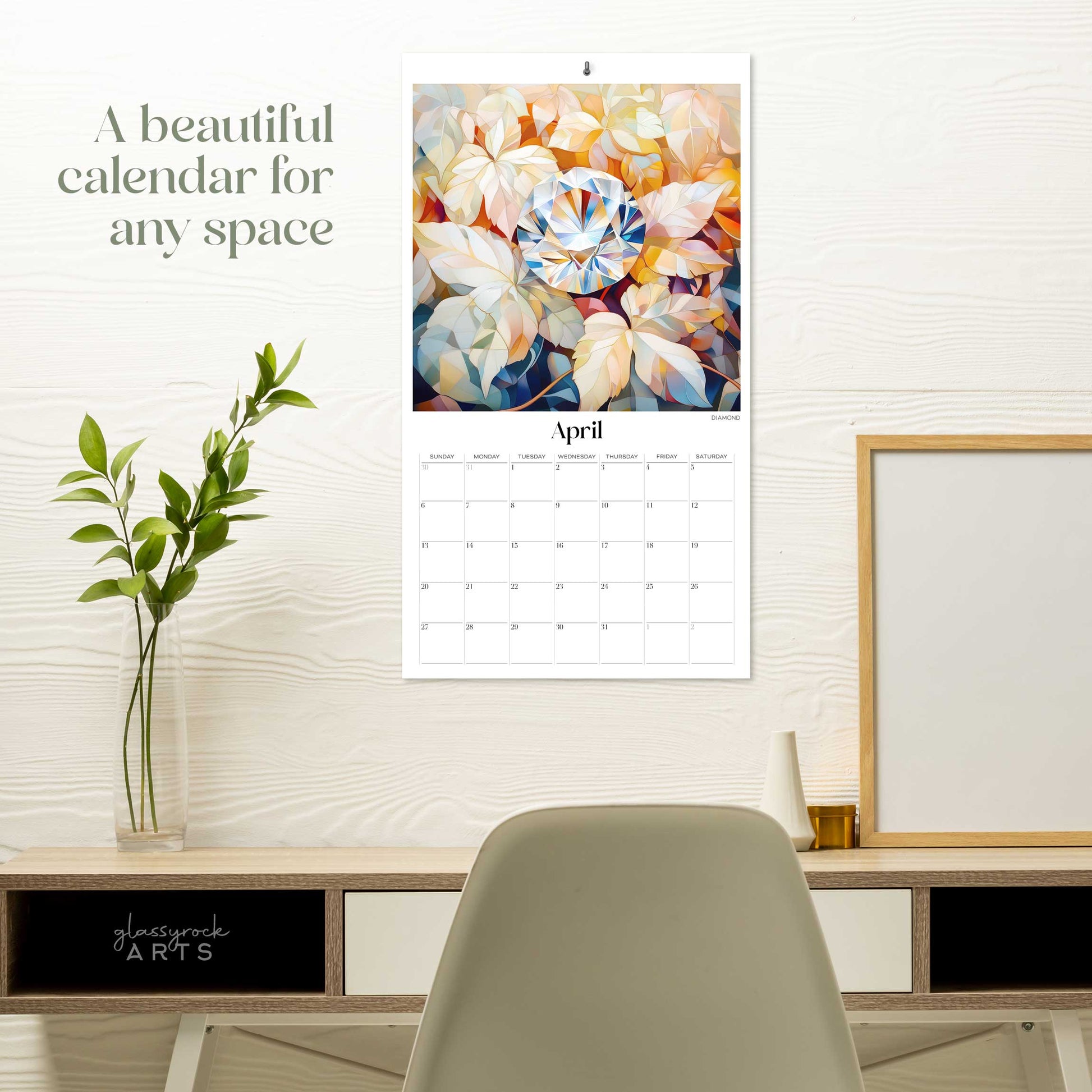 The birthstones calendar hanging on a white wall over a desk. The text reads "a beautiful calendar for any space."