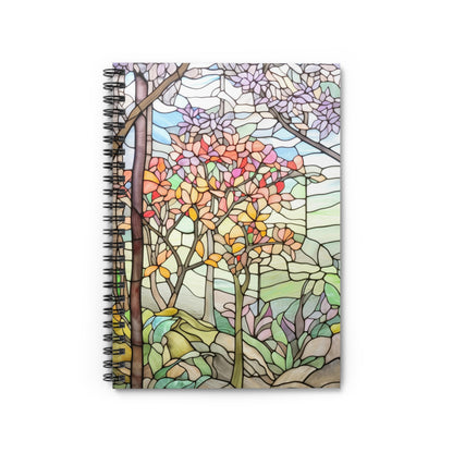 The Stained Glass Spring Forest Lined Spiral Notebook features a stained glass cover with colorful trees and natural scenery in red, orange, purple, and green. Perfect for journaling or as an artistic gift for any creative spirit.