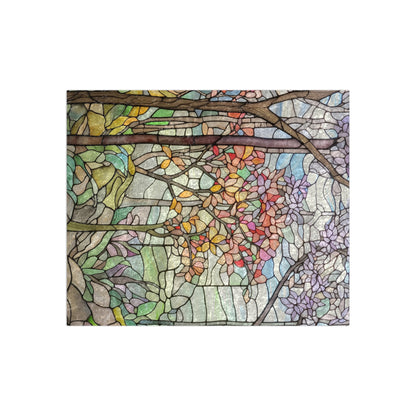 The Stained Glass Springtime Forest Crushed Velvet Blanket showcases a vibrant floral design with branches and leaves in shades of green, red, yellow, purple, and blue on a light background.