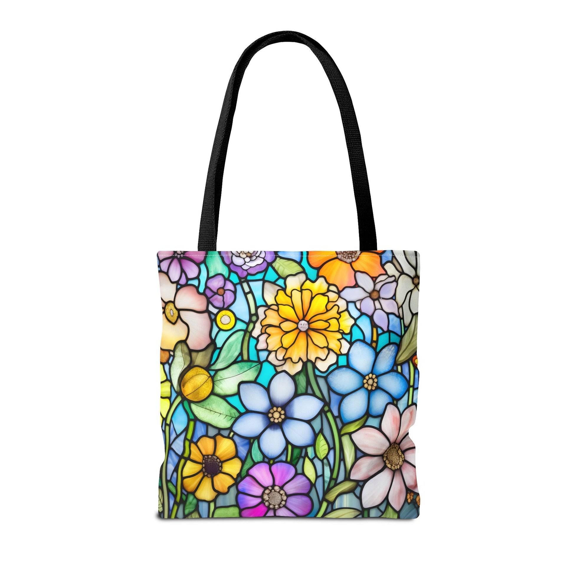 The Stained Glass Folk Art Flowers Tote Bag, available in three sizes, features a vibrant floral design with daisies and marigolds. Made from durable polyester, it includes sturdy black handles for both style and practicality.