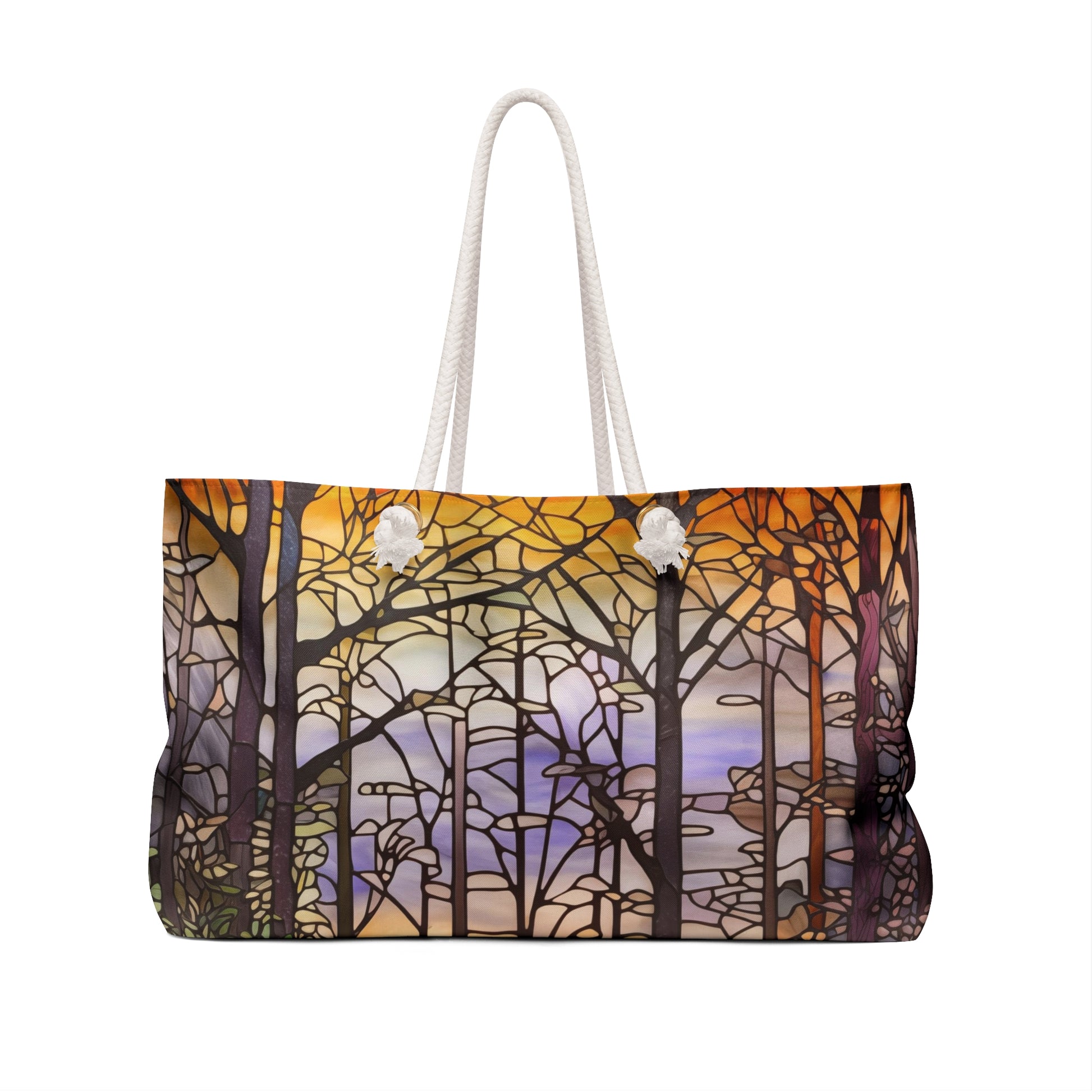 The Stained Glass Forest Oversized Tote Bag features a stained glass-style design of trees against a sunset sky in orange, purple, and blue. White rope handles contrast beautifully with the vibrant pattern, making it an ideal stained glass gift.