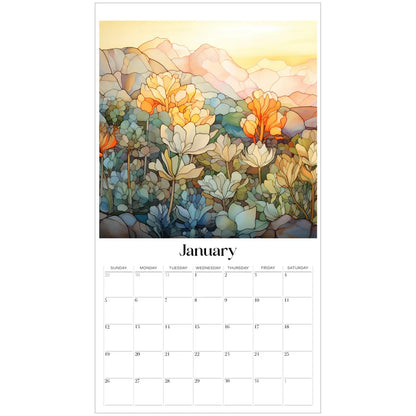 The January page of the 2025 Desert Landscapes Large Wall Calendar showcases a vibrant artistic illustration of orange and yellow flowers against a scenic mountain backdrop, reminiscent of botanical illustrations. The days are arranged in a clean grid below.