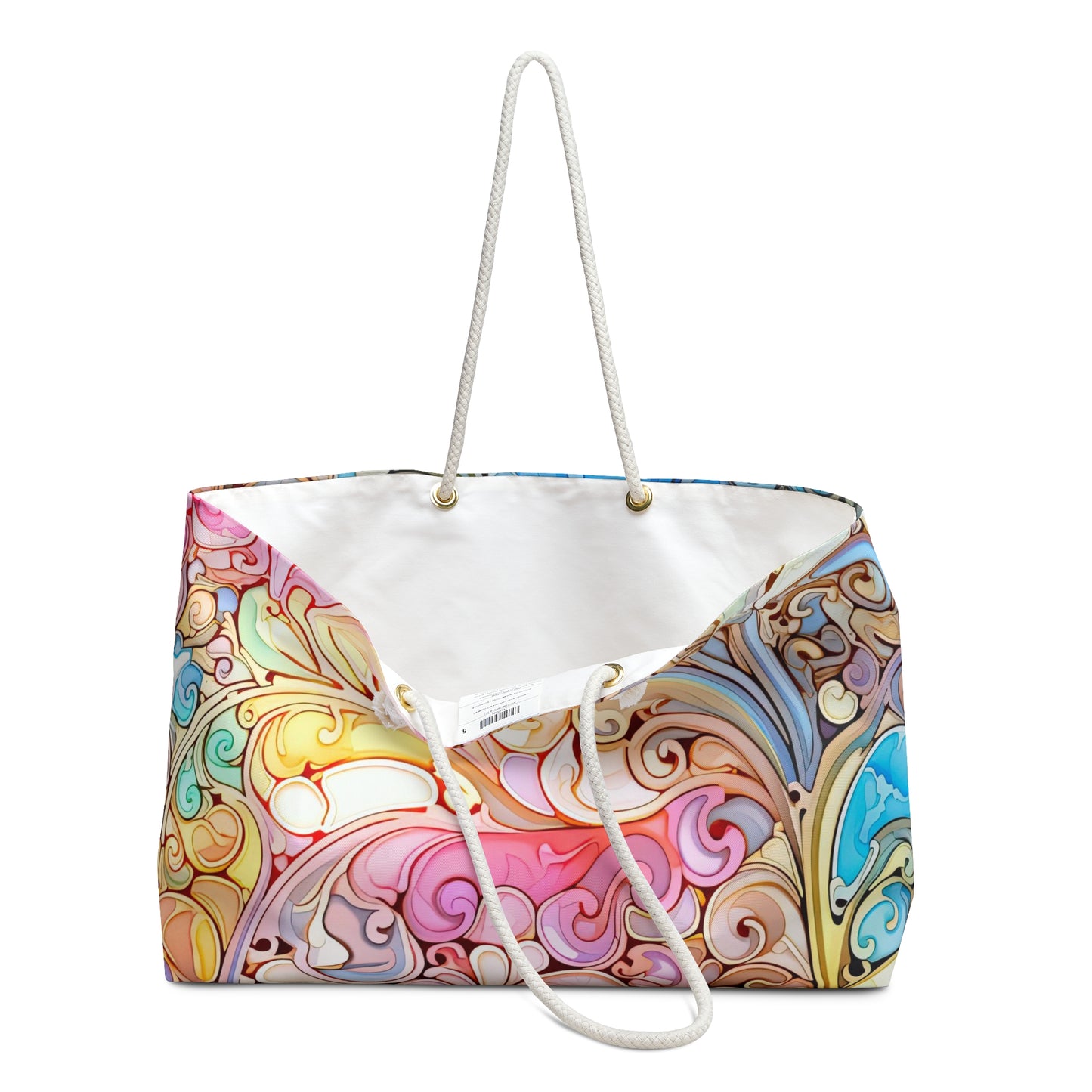 The Rainbow Paisley Stained Glass Oversized Tote Bag features colorful, intricate swirl patterns in pink, blue, orange, and white. With a bohemian style, it has white rope handles and an open top that reveals a spacious white interior.