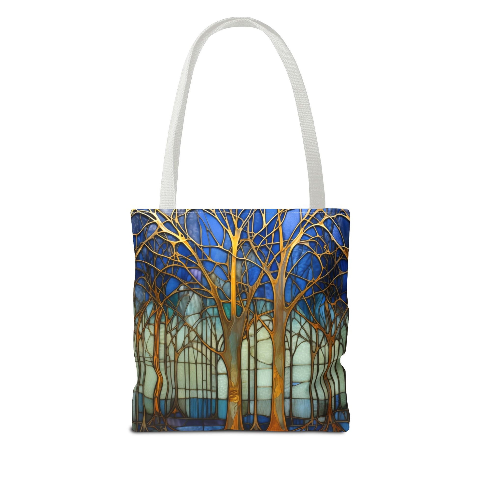 Stained Glass Blue Forest Tote Bag with white straps features a vibrant forest design with gold trees against a blue and white background. This stylish and sturdy tote bag is perfect for your daily errands and comes in three different sizes.