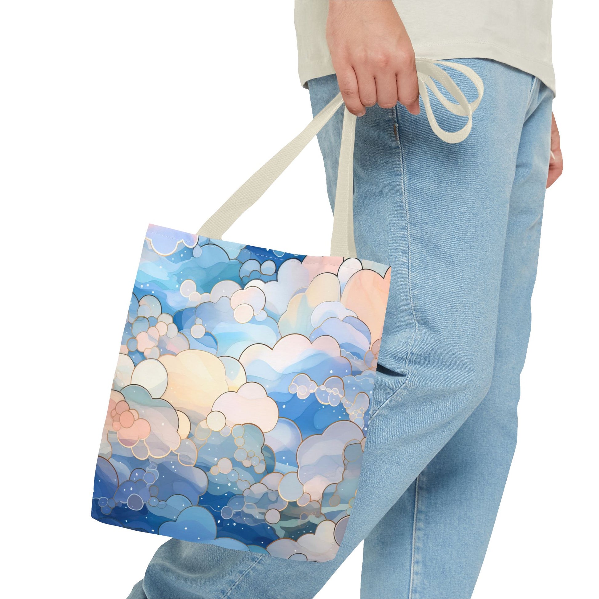 The Stained Glass Blue Clouds Tote Bag, available in 3 sizes, has handles and is crafted from durable polyester materials. It features an original artist's illustrated pattern of stained glass clouds in shades of soft blue.