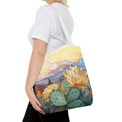 The Stained Glass Desert Cactus Tote Bag, crafted from durable polyester, showcases a nature-themed design with a botanical desert illustration of a landscape with succulents and cactus.