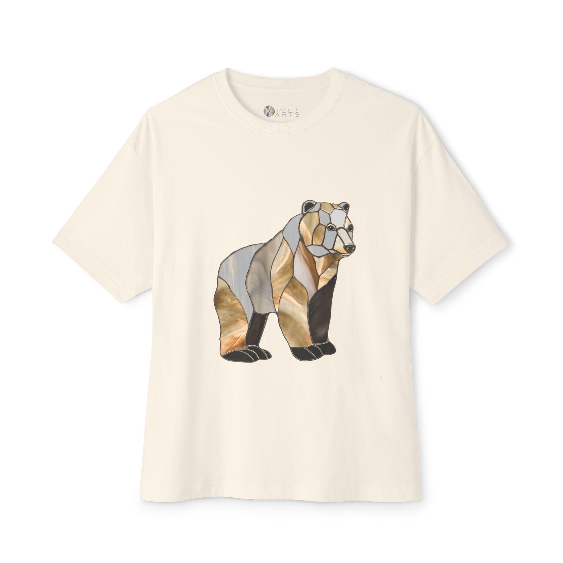 The Stained Glass Grizzly Bear Oversized Tee Shirt is a white oversized t-shirt featuring a geometric bear illustration on the front, crafted from sustainable materials and certified by the Fair Labor Association.