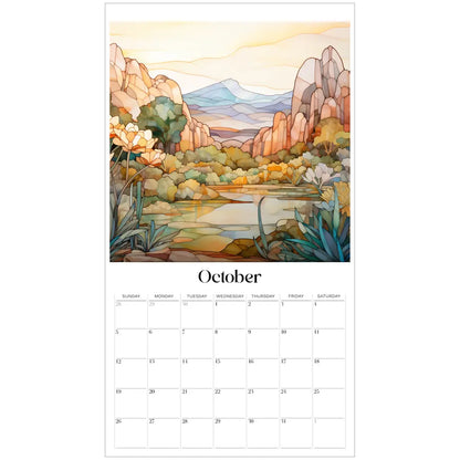 The 2025 Desert Landscapes Large Wall Calendar features an October page with a scenic view of mountains, trees, and a lake in vibrant orange and yellow tones. It includes the days of the month starting with Sunday below the artwork.