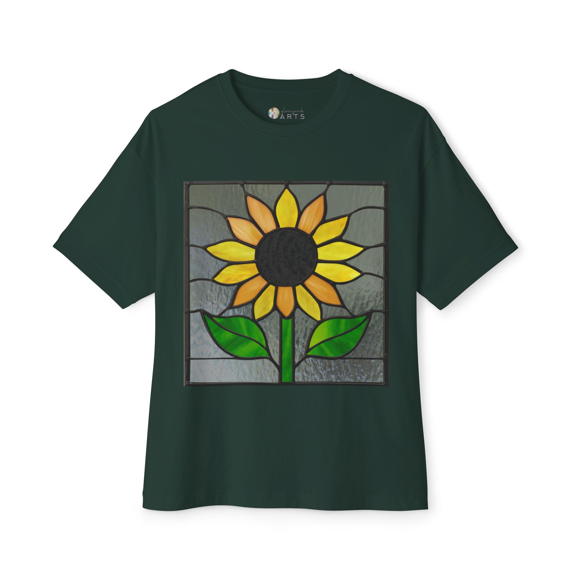 A Stained Glass Sunflower Oversized Tee Shirt by Bella+Canvas, presented in dark green and featuring an artist-designed stained glass-style sunflower with green leaves along with a yellow and brown flower.