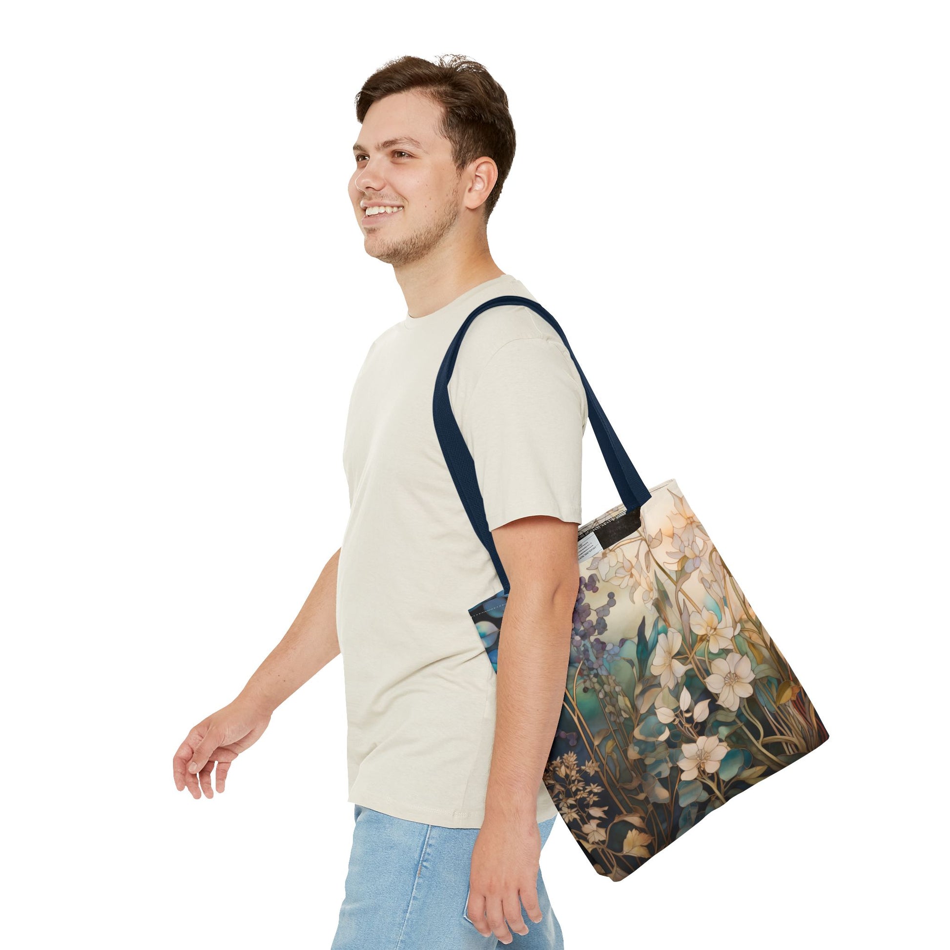 A person in a light shirt and jeans smiles while walking with the Stained Glass Midnight Flowers Tote Bag on their shoulder. The background is plain white.