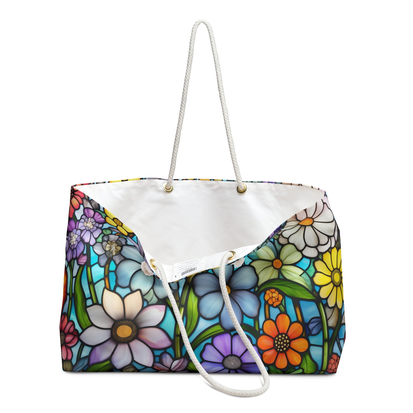 The Stained Glass Folk Art Flowers Oversized Tote Bag features a vibrant floral design, reminiscent of stained glass, with colorful flowers in white, yellow, orange, blue, and purple on a dark background and includes rope handles.