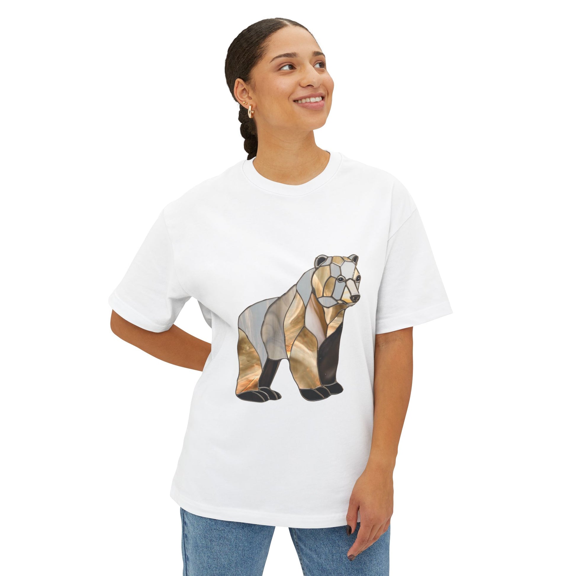 A person wearing an oversized Stained Glass Grizzly Bear Tee Shirt stands with one hand on their hip, looking upwards and smiling, proud to support sustainable clothing from a Fair Labor Association certified brand.