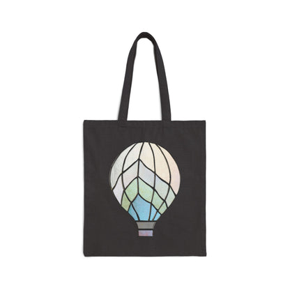 Stained Glass hot air balloon Cotton Canvas Tote Bag featuring a black canvas with a colorful, abstract teardrop-shaped stained glass design on the front.