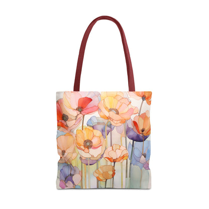 The Stained Glass Poppy Flowers Tote Bag, available in three sizes, is a vibrant accessory made from durable polyester. It features red handles and a stunning floral design with blooming flowers in shades of red, yellow, orange, pink, and purple.