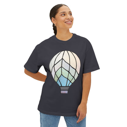 A person in a Stained Glass Hot Air Balloon Oversized Tee Shirt stands against a white background, smiling and looking upward.