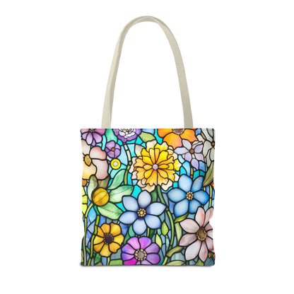 The Stained Glass Folk Art Flowers Tote Bag, available in 3 sizes, features an original design with vibrant yellow, blue, pink, and purple flowers amid lush green leaves. Made from durable polyester, it is finished with chic light-colored handles.