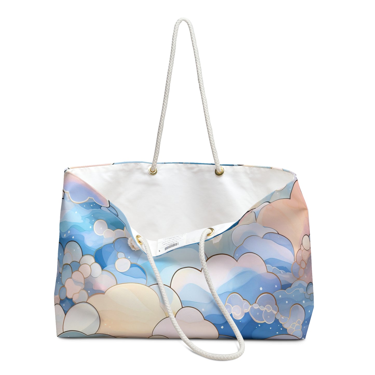 The Stained Glass Clouds Oversized Tote Bag, Blue, features long white rope handles and a cloud and bubble pattern in blue, white, and peach. Its pristine white interior has a small tag near the top edge—perfect for creative souls seeking an artistic gift.