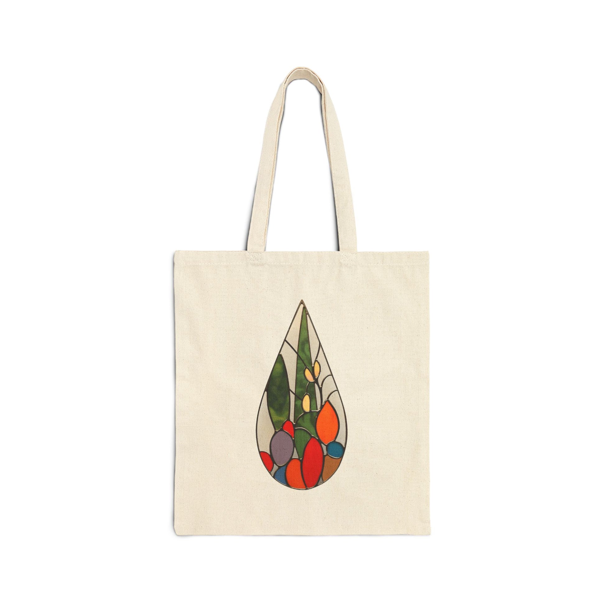 A beige cotton canvas tote bag with two handles, featuring a colorful abstract cactus teardrop design in the center inspired by stained glass artwork.