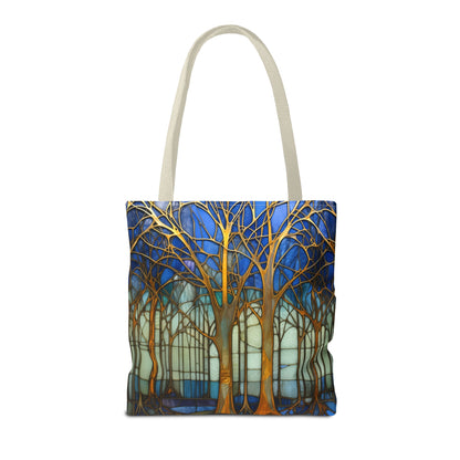 Stained Glass Blue Forest Tote Bag with beige straps features a vibrant forest design with gold trees against a blue and white background. Perfect for your daily errands and comes in three different sizes.