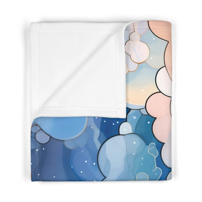 A picture of the Stained Glass Clouds Boho Baby Blanket, Blue Clouds Print from GlassyRock Arts. 