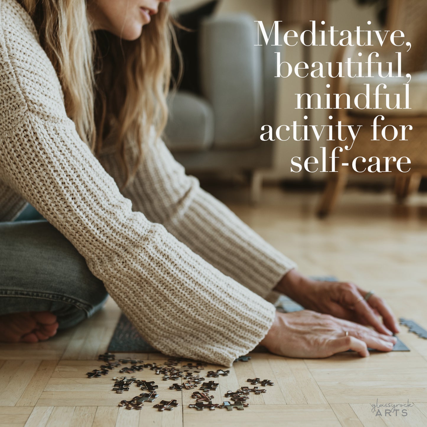 A woman does a jigsaw puzzle on the floor. Meditative beautiful mindful activity for self-care.