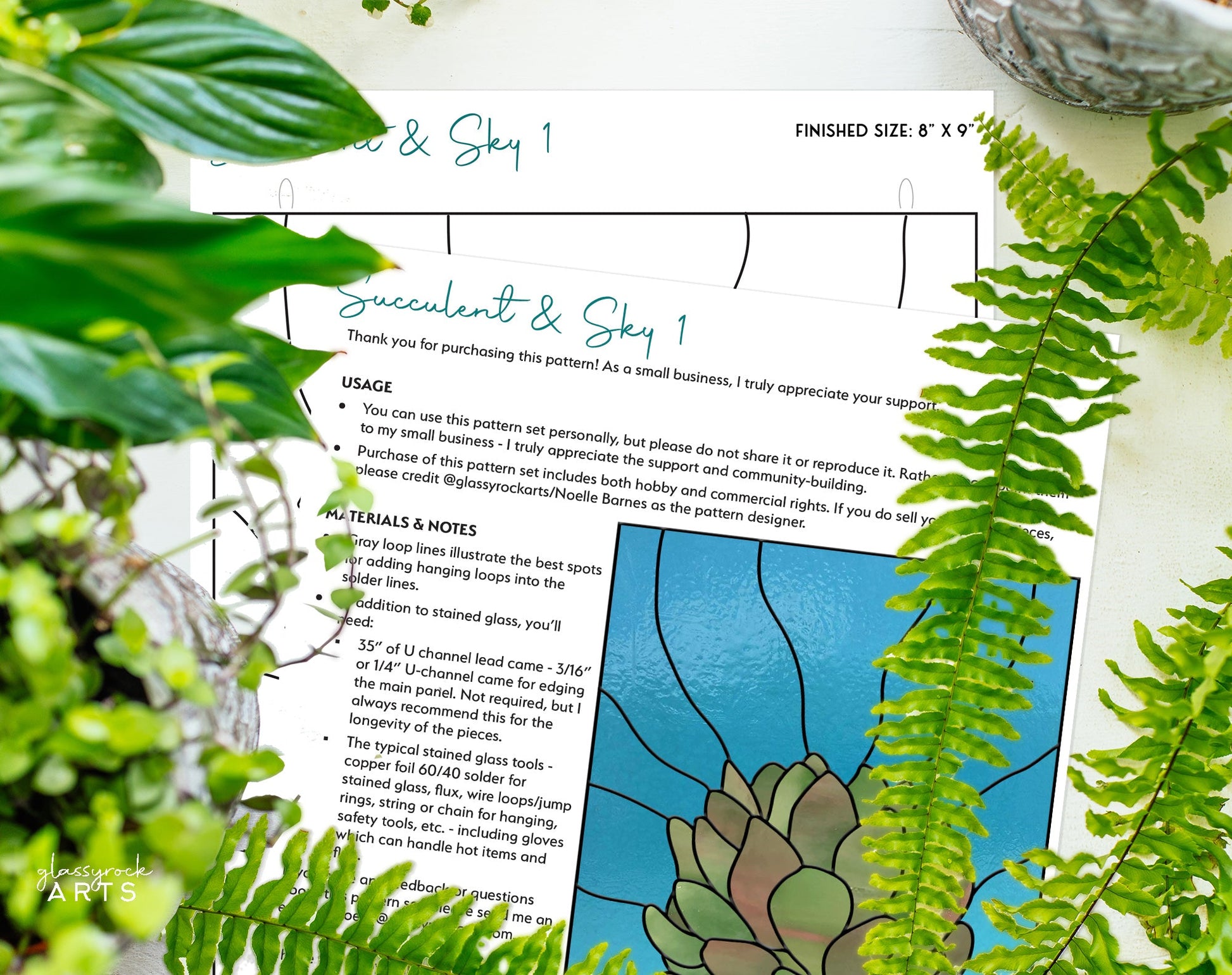 The close-up image features instructions for Three Succulent Stained Glass Panel Patterns amidst green foliage, detailing usage and materials. A hint of a colorful succulent design on a blue background is visible in the bottom right corner, suitable for those with a commercial license.