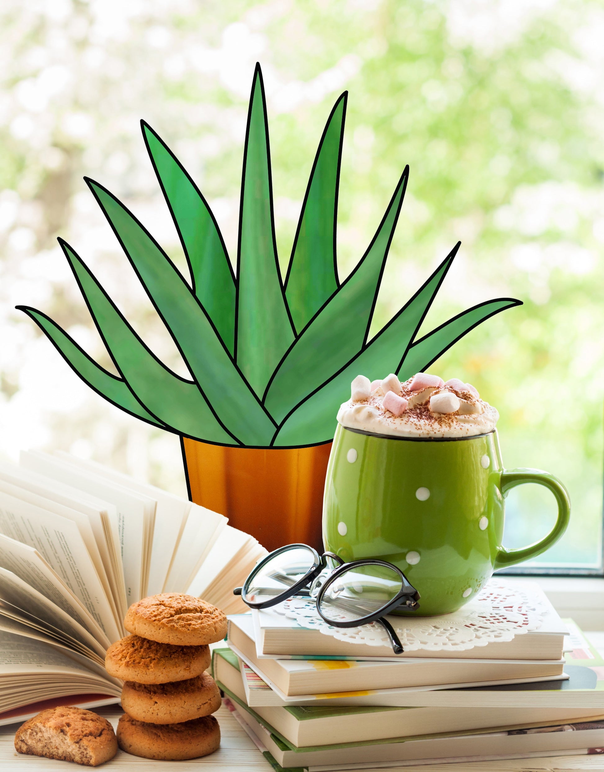 A Beginner Aloe Potted Plant with a stained glass pattern sits on the table next to an open book, a stack of closed books, and glasses. A green polka-dotted mug of hot cocoa topped with marshmallows rests on the books, while cookies are stacked beside them.