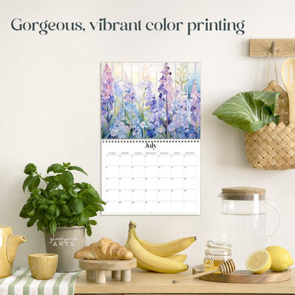 The birth flowers calendar hanging in a kitchen with kitchen tools below on a counter. It has gorgeous, vibrant color printing on premium paper.