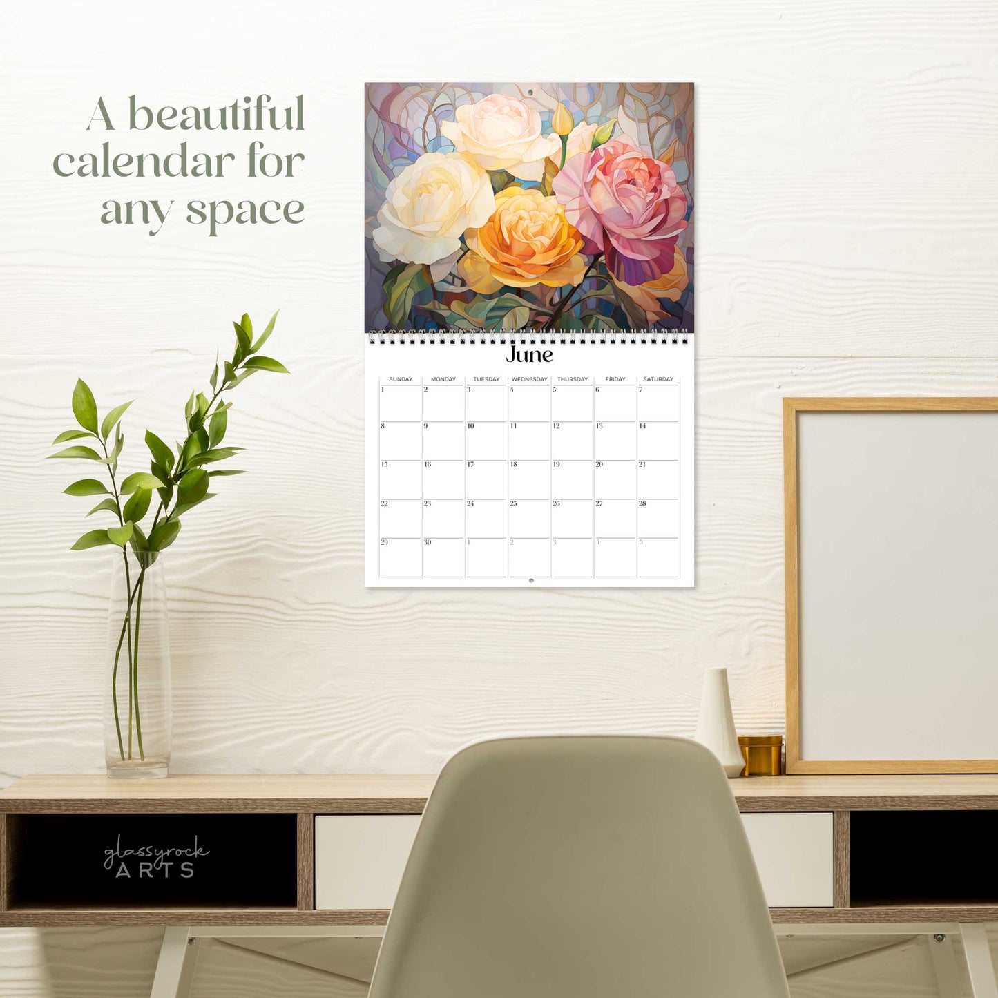 The birth flowers calendar hanging on a white wall over a desk. The text reads "a beautiful calendar for any space."