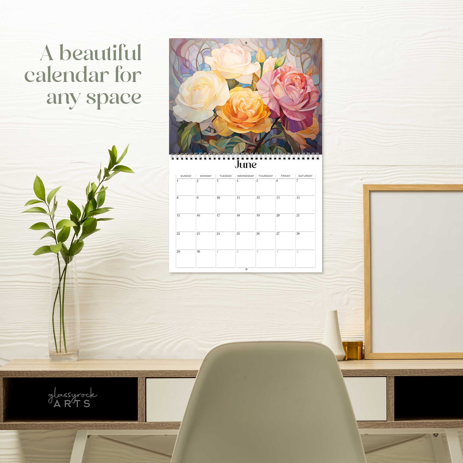 The birth flowers calendar hanging on a white wall over a desk. The text reads "a beautiful calendar for any space."