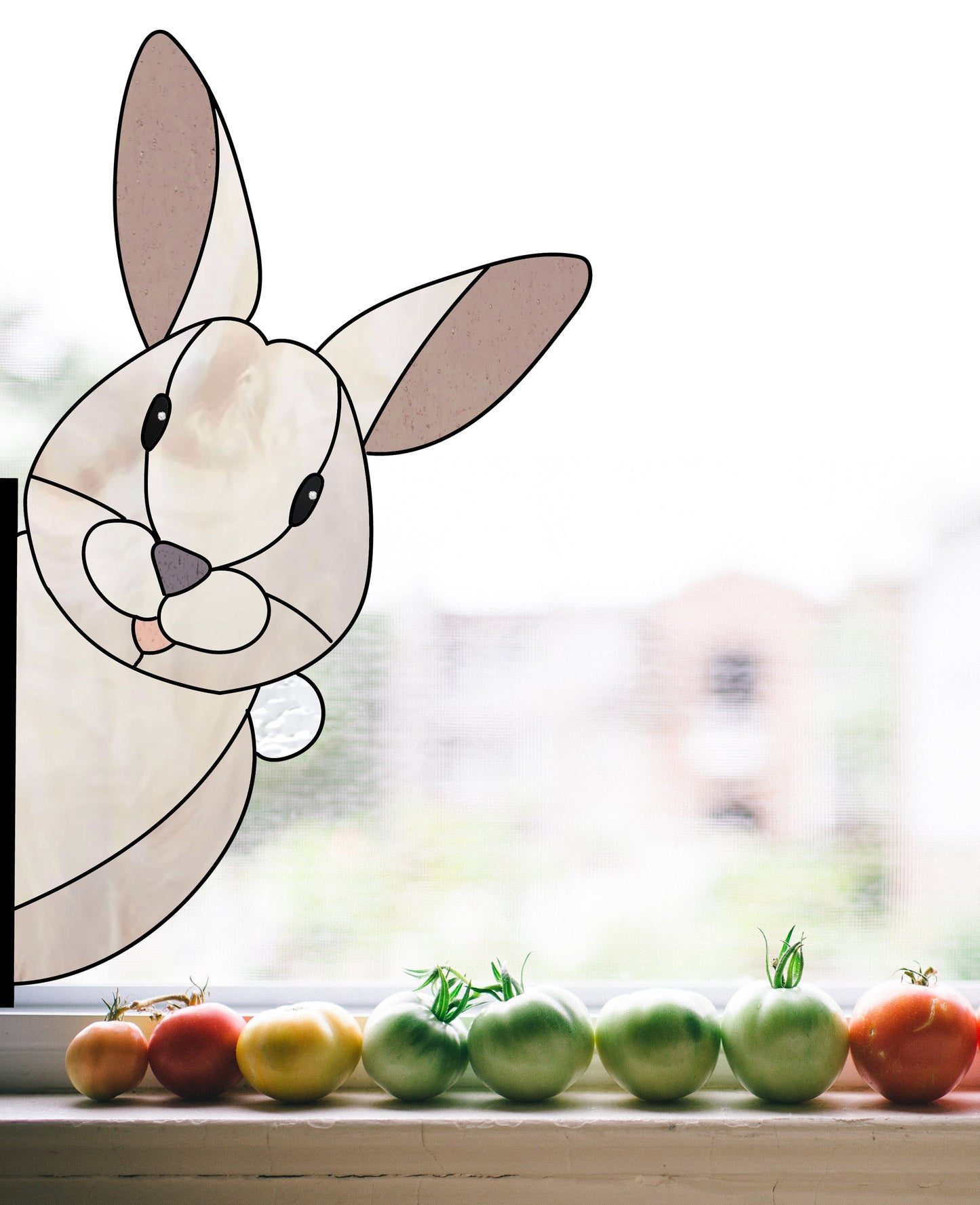 A Rabbit Buddy Bunny stained glass pattern brings whimsical beauty to your window with its warm smile. Tomatoes below range from green to red. Download this charming digital pattern with a commercial license to brighten any space.