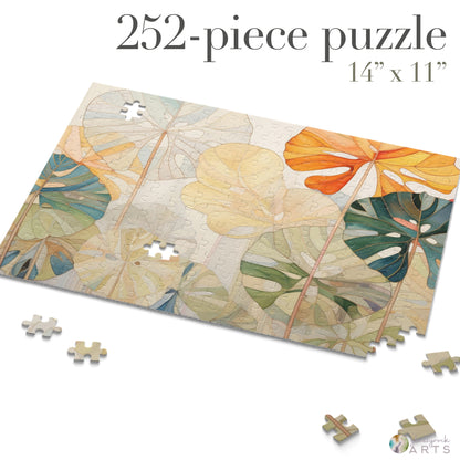 The Stained Glass Monstera Leaves Jigsaw Puzzle is a 252-piece set featuring vibrant tropical leaves in orange, yellow, green, and cream on a light background. Measuring 14 x 11, its the perfect art gift for couples who enjoy piecing together scattered puzzle segments.