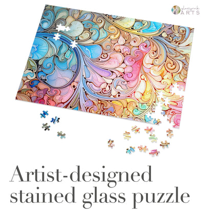 The Stained Glass Rainbow Paisley Jigsaw Puzzle, artist-designed with vibrant swirls and intricate patterns, is partially assembled on a white surface with scattered pieces. It makes a perfect gift for any puzzle enthusiast.