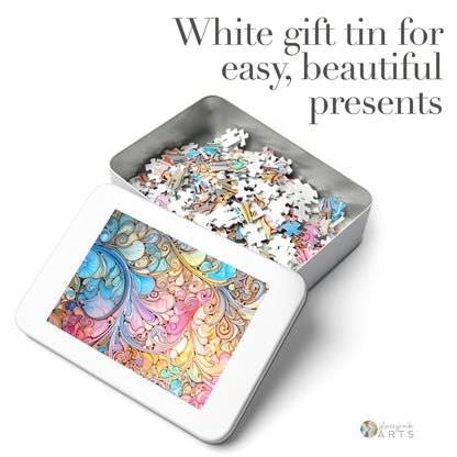 The Stained Glass Rainbow Paisley Jigsaw Puzzle comes in a white gift tin, adorned with a colorful swirling design worthy of a stained glass artist. The open tin reveals scattered puzzle pieces inside, perfect for easy and beautiful gifting.