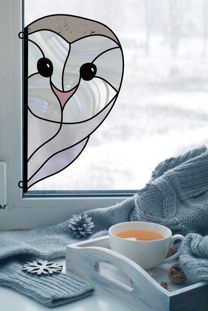 A Snowy Owl Stained Glass Pattern graces the window overlooking the snowy scene. Inside, a cozy setting includes a wooden tray with tea, nuts, and a pinecone on a soft blue knit blanket—a perfect inspiration for natures digital pattern seekers.