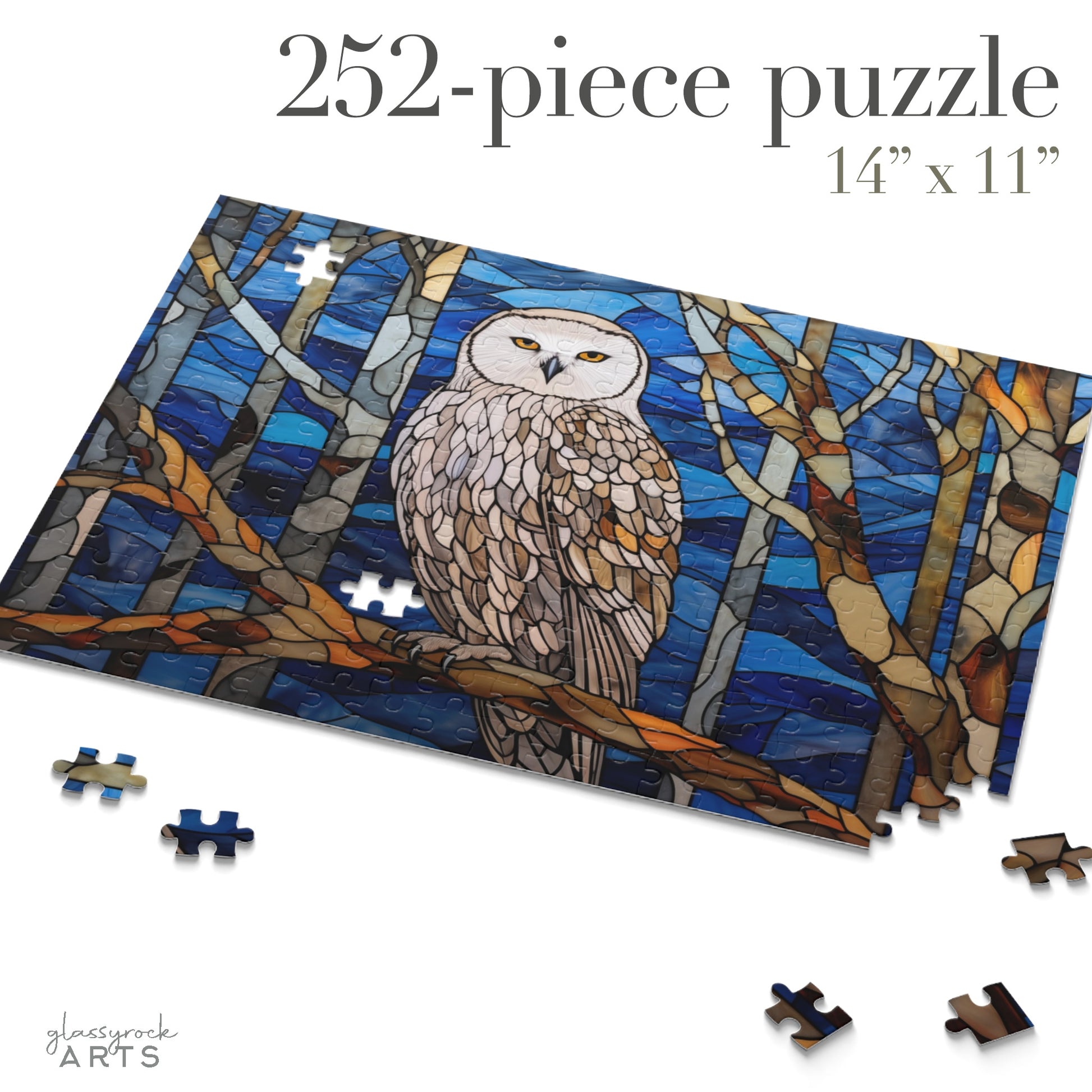 The Stained Glass Owl Jigsaw Puzzle is a 252-piece set showcasing a beautiful owl on tree branches against a blue backdrop. Its partially assembled with some pieces separated, measuring 14 x 11, and makes a perfect art gift for puzzle enthusiasts.