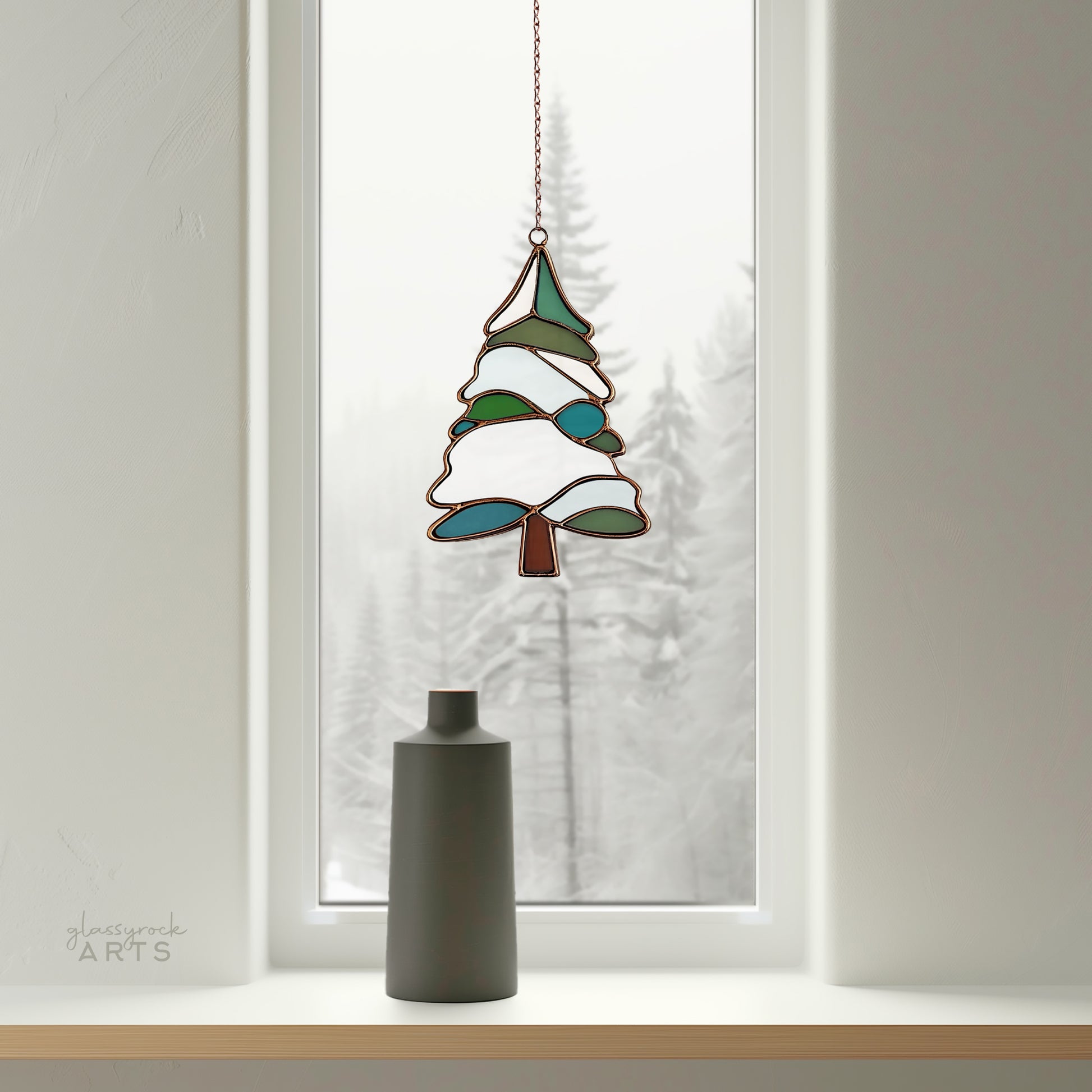 A picture of a snowy tree stained glass pattern from GlassyRock Arts.