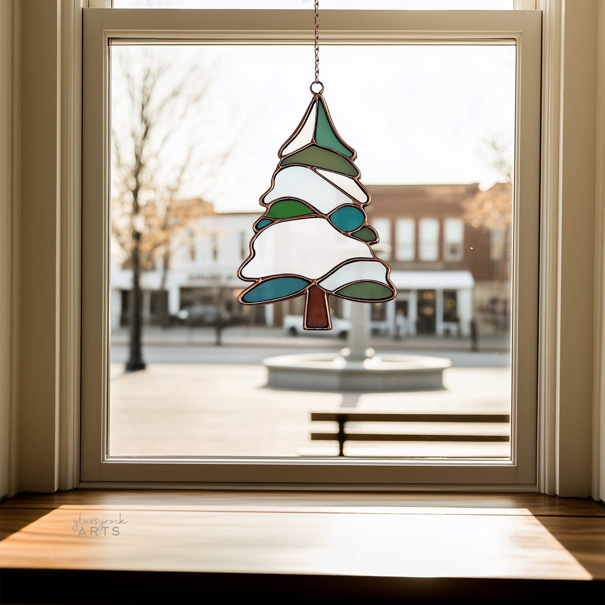 A picture of a snowy tree stained glass pattern from GlassyRock Arts.