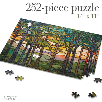 A colorful image of a stained glass-inspired forest jigsaw puzzle with green trees and hills and blue sky. 252 pieces.