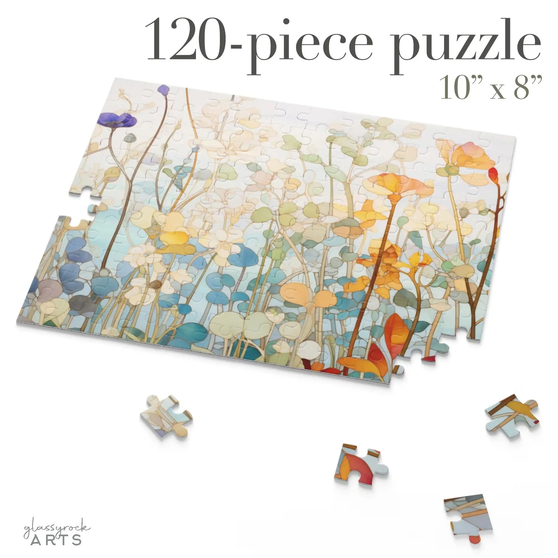 The Wildflower Botanicals Jigsaw Puzzle, partially assembled with 120 pieces, features a vibrant floral pattern of abstract flowers in orange, blue, and green. Scattered loose pieces add to the challenge. Measuring 10x8 inches, this stained glass-inspired design is a delightful floral gift.