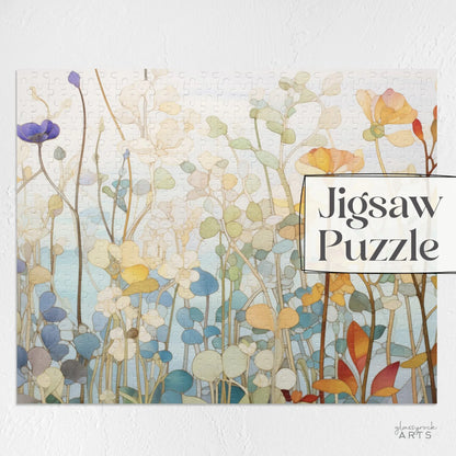 The Wildflower Botanicals Jigsaw Puzzle features an artistic display of wildflowers and plants in pastel hues on a light background. The phrase Jigsaw Puzzle is elegantly positioned on the right side, creating an ideal floral-themed gift.