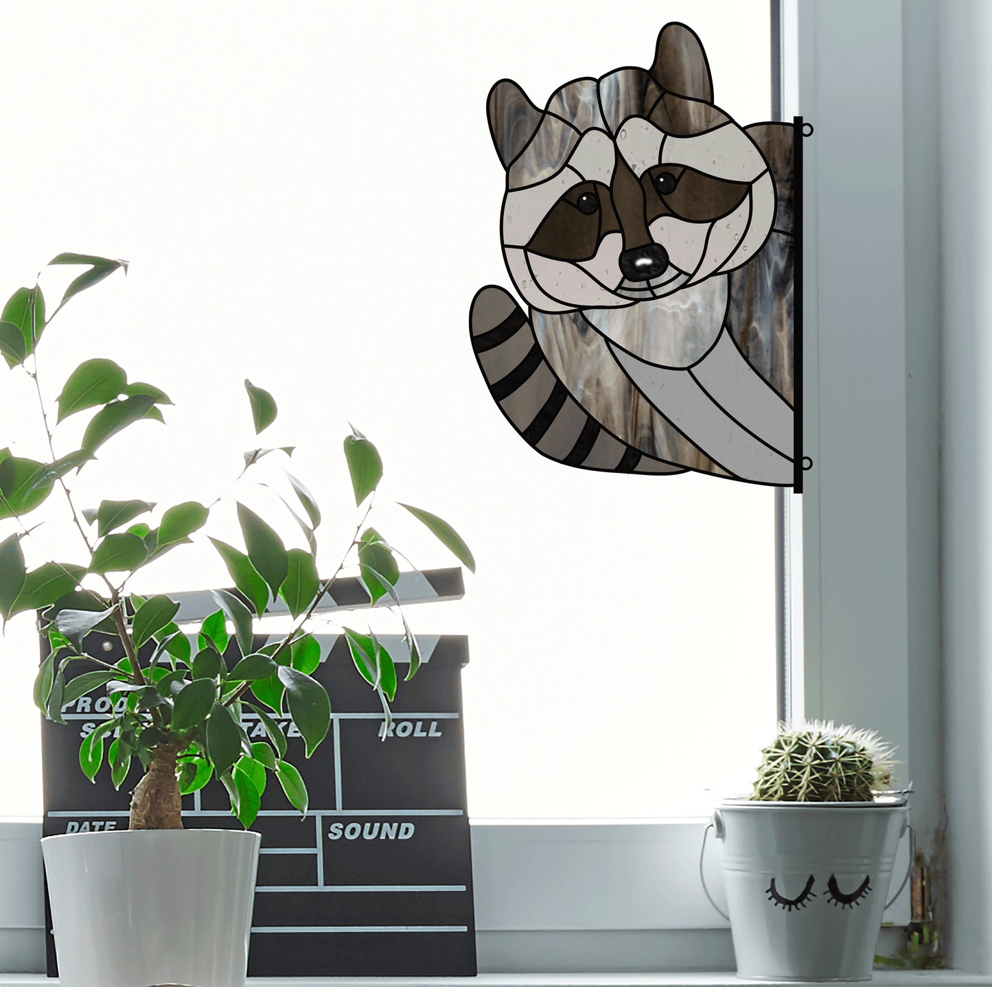 racoon stained glass pattern, instant pdf, shown in window with plant