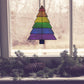 Beginner stained glass pattern for a rainbow Christmas tree, instant PDF download, shown hanging in a window with pine cones